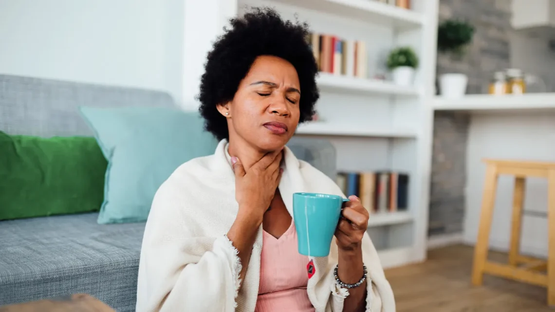 Introduction A sore throat usually lasts only a few days and often accompanies viral infections, seasonal allergies, or environmental irritants. However, when throat pain or irritation lingers for more than two weeks, it is considered a chronic sore throat. This persistent discomfort can interfere with speaking, eating, sleeping, and overall quality of life. Chronic sore throat is not a disease itself but a symptom of an underlying condition, ranging from allergies and acid reflux to chronic infections and throat muscle tension. Proper evaluation is essential because long-lasting throat symptoms require a different diagnostic approach than acute infections. This comprehensive guide explores the potential causes of chronic sore throat, the evaluation process, warning signs, and when to seek medical attention. Understanding Chronic Sore Throat What Does “Chronic” Mean? A sore throat is considered chronic when: • It persists longer than 2–3 weeks, OR • Repeated throat pain occurs frequently throughout the year Chronic sore throat may be constant or intermittent, mild or severe, and may involve swelling, burning, dryness, or voice changes. Common Causes of Chronic Sore Throat 1. Postnasal Drip (Allergies or Sinus Issues) Excess mucus that drips down the back of the throat can cause ongoing irritation. Common causes: • Seasonal allergies • Dust mites or mold • Chronic sinusitis • Weather changes Symptoms: • Need to clear the throat • Morning irritation • Cough • Mucus sensation in the throat 2. Laryngopharyngeal Reflux (LPR) Often called “silent reflux,” LPR occurs when stomach acid or enzymes reach the throat. Symptoms: • Chronic hoarseness • Throat clearing • Dry cough • Lump-in-throat sensation Unlike GERD, LPR often occurs without heartburn. 3. Gastroesophageal Reflux Disease (GERD) Backflow of stomach acid irritates the esophagus and throat. Symptoms: • Heartburn • Sour taste • Nighttime irritation • Cough after meals 4. Chronic Tonsillitis Recurrent tonsil infections can lead to: • Persistent swelling • Tonsil stones • Bad breath • Painful swallowing 5. Smoking or Vaping Tobacco smoke and vape chemicals irritate the throat lining. Symptoms: • Dryness • Burning • Persistent irritation 6. Environmental Irritants Chronic exposure to: • Air pollution • Dry air • Chemical fumes • Cleaning agents …can lead to long-lasting throat issues. 7. Mouth Breathing Often due to nasal blockage, this causes the throat to dry out, especially at night. 8. Chronic Infections Some infections can linger, including: • Fungal infections • Mononucleosis (EBV) • Recurrent bacterial infections 9. Voice Misuse or Overuse Common in teachers, singers, speakers, and call-center workers. Symptoms: • Hoarse voice • Throat fatigue • Pain when speaking 10. Thyroid Enlargement (Goiter) An enlarged thyroid can put pressure on the throat, causing discomfort or a choking sensation. 11. Neuropathic Throat Pain In rare cases, nerve irritation causes chronic throat pain without physical inflammation. 12. Anxiety or Stress Stress increases muscle tension in the throat, leading to tightness or discomfort. Less Common but Important Causes 1. Autoimmune Conditions • Sjögren’s syndrome (dry throat) • Sarcoidosis 2. Tumors of the Throat or Voice Box Though rare, chronic throat pain with red flags requires urgent evaluation. Warning signs include: • Unexplained weight loss • Persistent hoarseness • Blood in saliva • One-sided throat pain • Difficulty swallowing Symptoms That Suggest a Serious Cause Seek medical attention if you experience: • Sore throat lasting longer than 3 weeks • Severe or one-sided pain • Difficulty breathing or swallowing • Neck lumps or swelling • Hoarse voice lasting more than 2–3 weeks • Persistent fever • Night sweats • Unintentional weight loss How Chronic Sore Throat Is Evaluated 1. Medical History Review Your doctor may ask about: • Duration of symptoms • Allergies • Acid reflux • Snoring or sleep apnea • Voice use patterns • Environmental exposures • Smoking or vaping habits 2. Physical Examination This includes: • Mouth and tonsil inspection • Neck palpation for swelling • Nasal and sinus evaluation • Listening for postnasal drip or congestion 3. Laryngoscopy A small flexible camera is inserted through the nose to examine: • Throat structures • Vocal cords • Signs of reflux or swelling 4. Allergy Testing Recommended when symptoms suggest chronic postnasal drip. 5. Reflux Testing Such as: • pH monitoring • Upper endoscopy These are used when reflux is suspected but unconfirmed. 6. Blood Tests To check for: • Infections • Inflammation • Autoimmune conditions 7. Imaging Tests Ultrasound, CT, or MRI is used if structural issues or tumors are suspected. Treatment Options for Chronic Sore Throat 1. For Allergies and Postnasal Drip • Antihistamines • Nasal saline rinses • Nasal steroid sprays • Avoiding allergens 2. For LPR or GERD • Dietary changes • Avoiding trigger foods • Eating smaller meals • PPIs or H2 blockers • Sleeping with head elevated 3. For Dry Air and Environmental Irritants • Use a humidifier • Increase ventilation • Avoid chemical fumes 4. For Chronic Tonsillitis • Antibiotics (if bacterial) • Tonsil removal for repeated infections 5. For Voice Strain • Voice therapy • Resting vocal cords • Hydration 6. For Smoking/Vaping Irritation • Quit smoking • Avoid secondhand smoke 7. For Stress-Related Throat Tightness • Relaxation techniques • Breathing exercises • Stress management 8. For Fungal or Persistent Infections • Antifungal medications • Antiviral care (if applicable) Self-Care Tips for Managing Chronic Throat Irritation • Stay hydrated • Avoid yelling or overusing your voice • Use steam inhalation for soothing relief • Gargle with warm saltwater • Avoid spicy, acidic, and fried foods if reflux is suspected • Sleep with a humidifier • Keep the environment free of dust and irritants Conclusion A chronic sore throat is more than just a minor annoyance—it can be a clue to an underlying condition that needs attention. From allergies and acid reflux to tonsillitis and voice misuse, various factors can cause long-term throat irritation. Identifying the root cause is essential for effective treatment and long-term relief. If your sore throat lasts more than two weeks, recurs frequently, or is accompanied by concerning symptoms such as hoarseness, weight loss, or difficulty swallowing, seek a medical evaluation promptly. With proper diagnosis and targeted treatment, most causes of chronic sore throat can be managed successfully. FAQs 1. How long is “too long” for a sore throat? Any sore throat lasting more than 2–3 weeks should be evaluated by a doctor. 2. Can allergies cause a chronic sore throat? Yes. Allergies are one of the most common causes of postnasal drip. 3. Can stress or anxiety cause throat tightness? Yes. Stress increases muscle tension, often leading to throat discomfort. 4. Is a chronic sore throat a sign of cancer? Usually not, but persistent hoarseness, weight loss, or one-sided pain should be checked. 5. Should I see an ENT for chronic throat irritation? Yes. An ENT specialist can evaluate your throat, vocal cords and rule out serious causes.